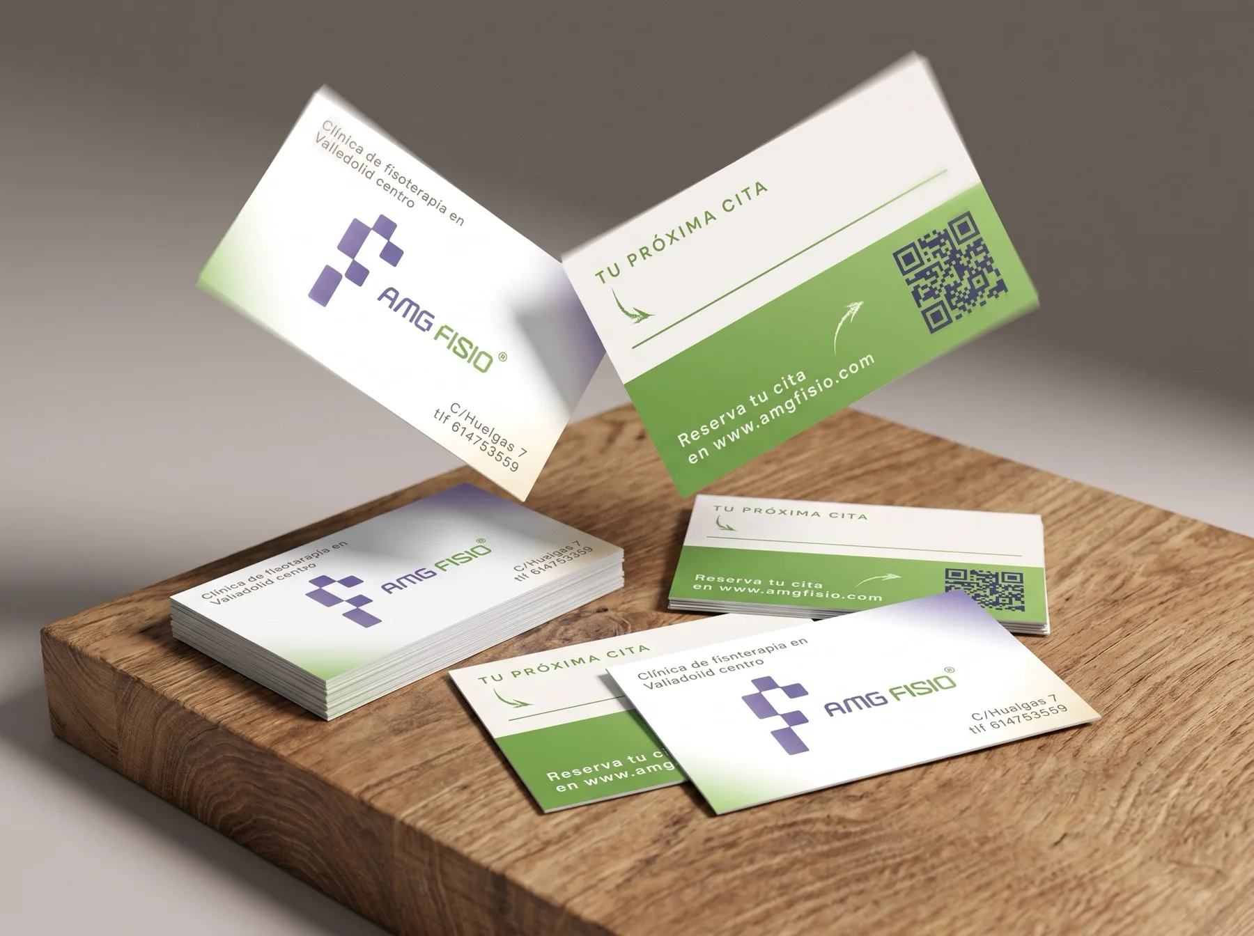 Mockup of the printed business cards stacked and fanned on a neutral surface