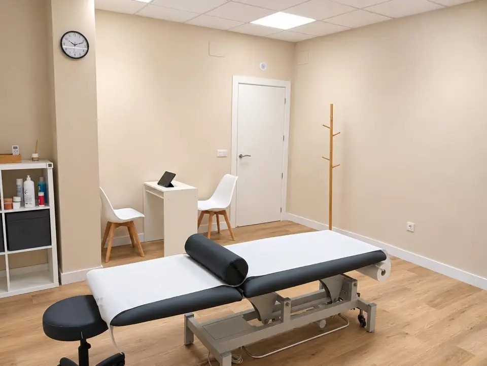 Treatment room with a couch and a desk