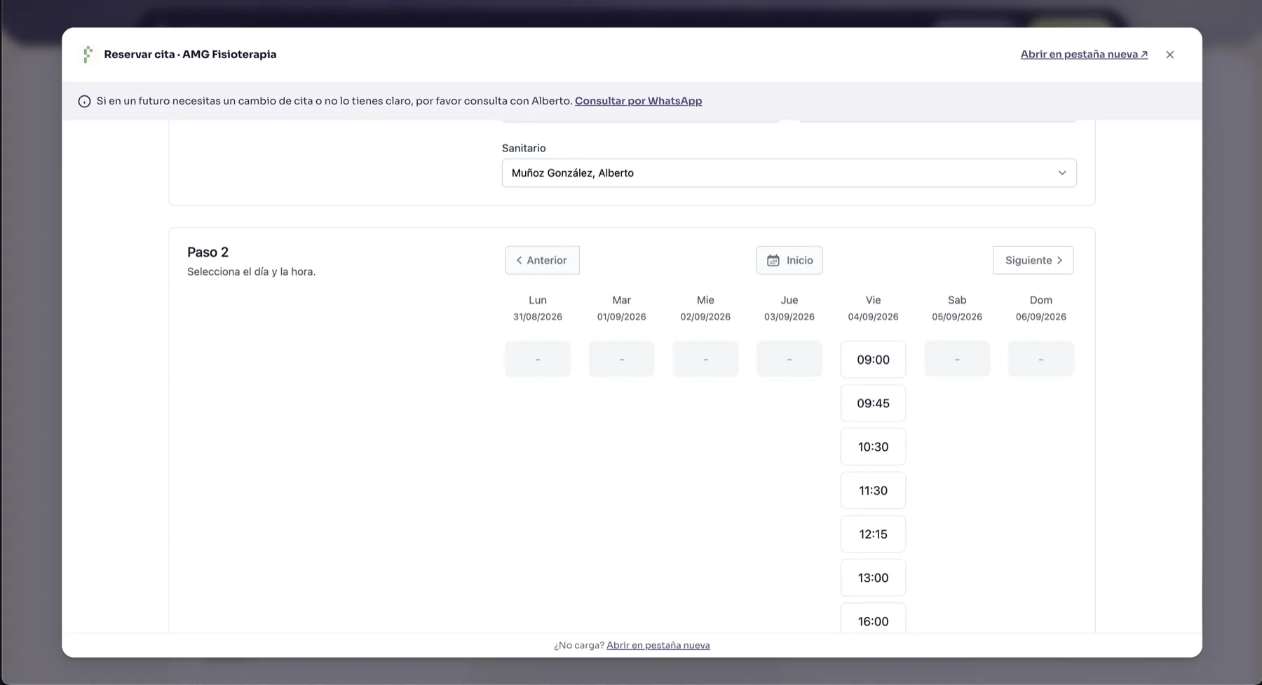 The booking overlay on amgfisio.com: a Reservar cita panel rendering QClinics step two, with the therapist selected and a week of time slots, a WhatsApp note on top and links to open the platform in a new tab