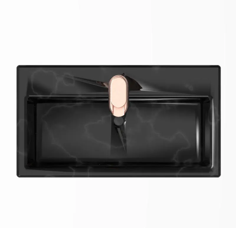 Top view of the faucet centred in a rectangular black marble basin