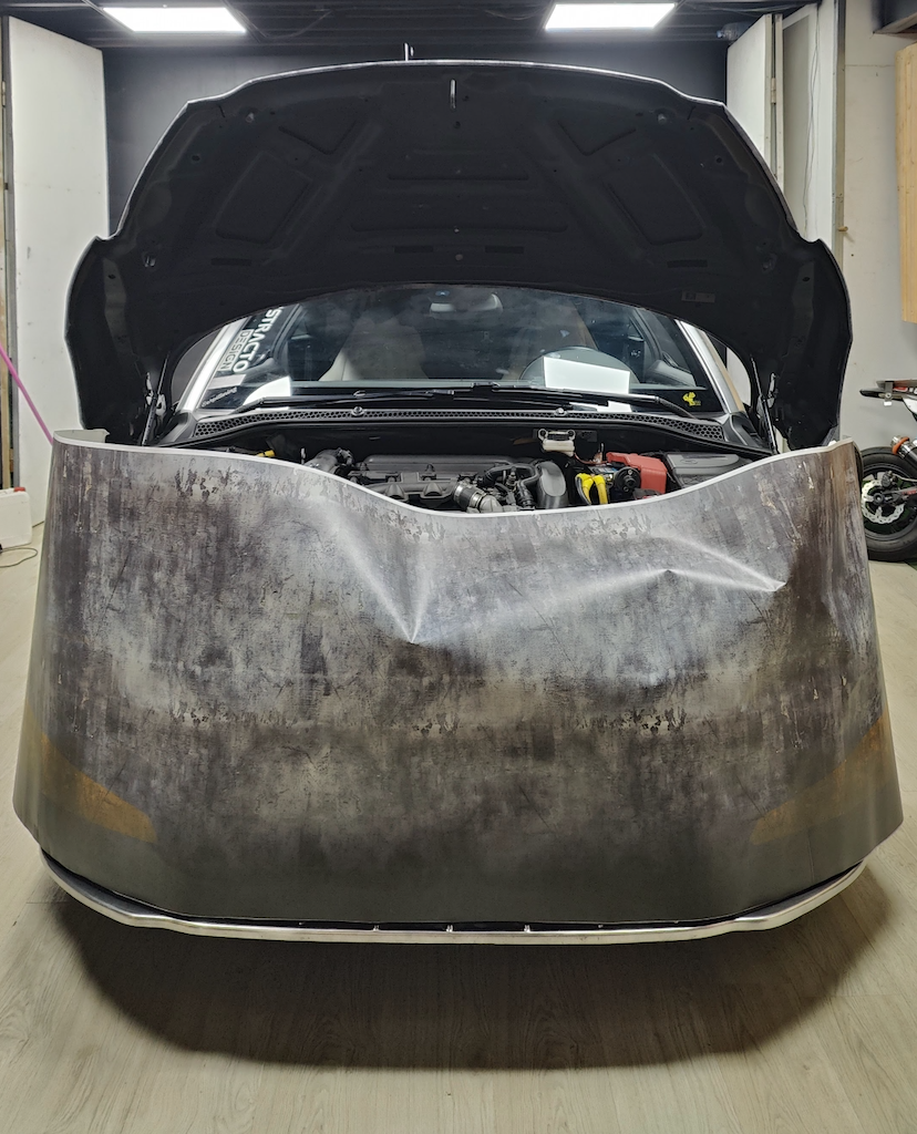 Preparing vinyl panel position on the Peugeot RCZ during installation, aligning graphics before squeegee application